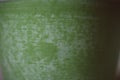 Green texture of handmade pottery. Close up view of green ceramic surface. Royalty Free Stock Photo