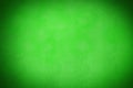 Green textured backdrop is creating soft vignette effect in flat design style, copy space Royalty Free Stock Photo