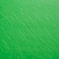 Green textured surface with numerous interwoven lines creating a crisscross pattern Royalty Free Stock Photo