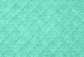 green textures background, close-up of sea green quilt, aquamarine counterpane bedspread Royalty Free Stock Photo