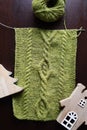 knitted scarf, hobby, the beginning of the process, handmade, needlework, green yarn,