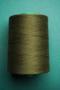 Green thread spool background, close-up Royalty Free Stock Photo