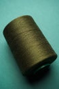 Green thread spool background, close-up Royalty Free Stock Photo