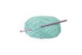 green thread spool with purple crochet hook Royalty Free Stock Photo