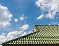 Green tile roof on a new house with blue sky Royalty Free Stock Photo