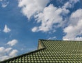 Green tile roof on a new house with blue sky Royalty Free Stock Photo