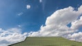 Green tile roof on a new house with blue sky