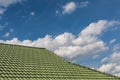 Green tile roof on a new house with blue sky Royalty Free Stock Photo