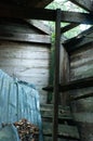 Rustic abandoned shed interior with light streaming in from above Royalty Free Stock Photo