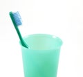 Green tooth-brush and dish