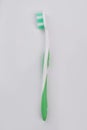 Green tooth brush isolated on white background.