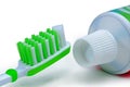 Green toothbrush and toothpaste isolated on a white background Royalty Free Stock Photo