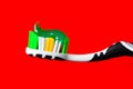 Green toothpaste beautifully lies on a toothbrush on a red background Royalty Free Stock Photo