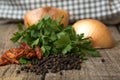 Green tops of parsley, onion, black pepper beans and dry chili Royalty Free Stock Photo