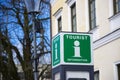 Green Tourist information sign in the city center. Tourist point, help desk, city guide Royalty Free Stock Photo