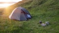 Green tourist tent in camp among meadow in the mountain.Nature background Royalty Free Stock Photo