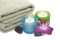 Green Towel, Orchid, Candles and Pebbles