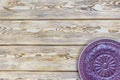 Green towel over wooden kitchen table. View from above with copy space Royalty Free Stock Photo