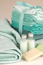 Green towels with soap and shampoo