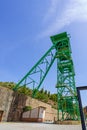 Green tower of a well extraction of a mine of salt or potash in disuse. Royalty Free Stock Photo