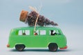 Green toy van with Christmas tree Royalty Free Stock Photo
