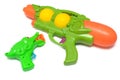 Green toy water and sound gun against a white backdrop Royalty Free Stock Photo