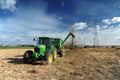 Green tractor in the farm field