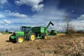 Green tractor in the farm field