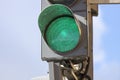 Green traffic light close-up against blue sky Royalty Free Stock Photo