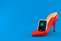 Green traffic light inside high heel