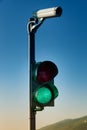Green on traffic light with security camera Royalty Free Stock Photo