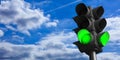 Green traffic lights on blue sky background, copy space. 3d illustration Royalty Free Stock Photo