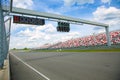 Green traffic lights over the race track Royalty Free Stock Photo