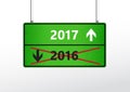 Green traffic sign with upcoming 2017 and cross out 2016 year