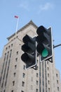 A green traffic signal in frong of an old building of shanghai Royalty Free Stock Photo