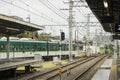 Green train enters local station in Kyoto, Royalty Free Stock Photo