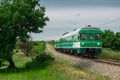 Green train or zeleni vlak, connecting Ljubljana, Slovenia and Pula, Croatia, on its way towards the end station. Picturesque Royalty Free Stock Photo