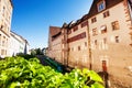 Green tram at the narrow street of Basel old town Royalty Free Stock Photo