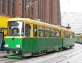 Green tram on street