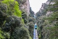 Green tramway in mountain landscape, Montserrat, near Barcelona, Spain