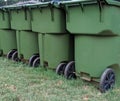 Green trash bins, recycling trash cans on grass Royalty Free Stock Photo