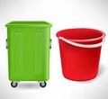 Green trash container and red bucket