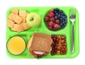 Green tray with tasty food and juice on white background, top view. School lunch Royalty Free Stock Photo