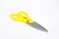 A large pair of scissors with yellow handles Royalty Free Stock Photo