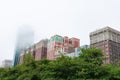 Green Trees in front of Old and New Buildings on Michigan Avenue covered in Fog in Chicago Royalty Free Stock Photo