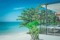 Green trees on sand beach with beautiful seascape view and blue sky in the background at Chao Lao Beach, Chanthaburi Province. Royalty Free Stock Photo