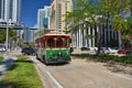 Green trolley goes on Downtown Miami street