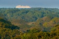 Green tropic jungle forest with big cruise chip on the sea. Exotic landscape in Carara NP in Costa Rica. Big boat in the water,