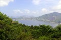 Green Tropical mountains and hiking route on the Dragon's Back trail near Hong Kong Royalty Free Stock Photo