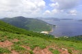 Green Tropical mountains and hiking route on the Dragon's Back trail near Hong Kong Royalty Free Stock Photo